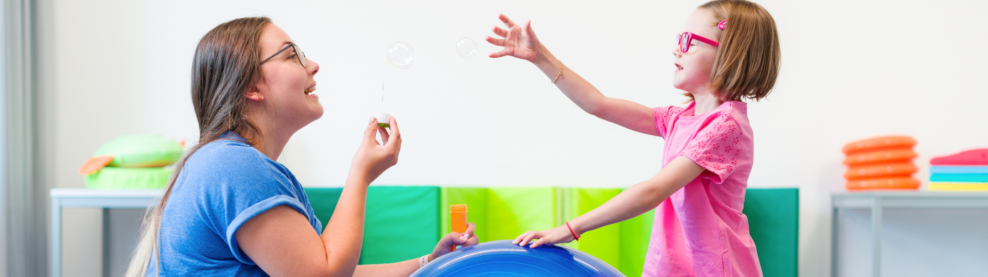 physical therapist with student — What Paperwork Is Required of School-Based PTs?