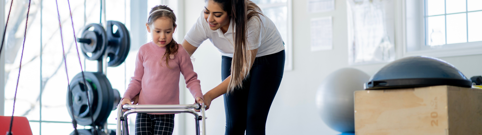 school physical therapist helping a student — A Day in the Life of a Physical Therapist