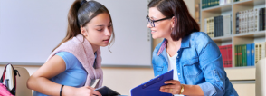 school therapist with student — How to Become a School Therapist